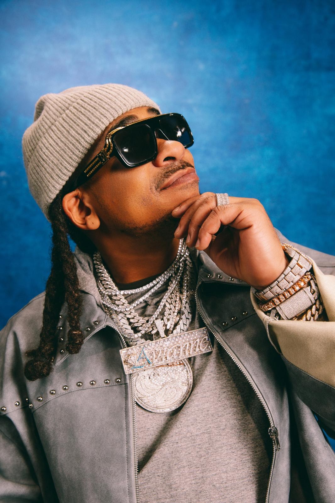 Max B studio portrait, blue backdrop
