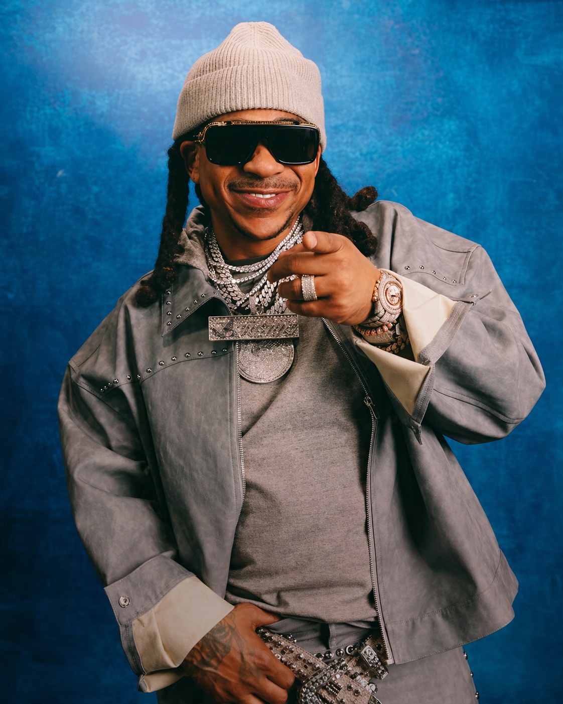 Max B studio portrait, blue backdrop